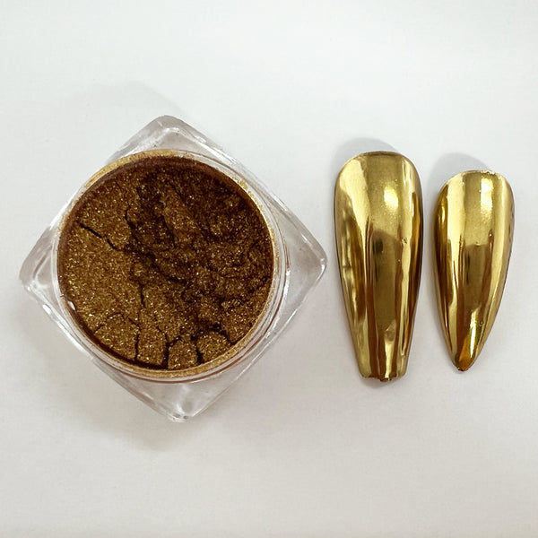 CP-DF08 Mirror Deep Gold Pigment Powder & nails painted with the pigment used in a nail paint blend. Not approved for cosmetic use, but OK for nail applications. Available in 2g Sample & 30g sizes.